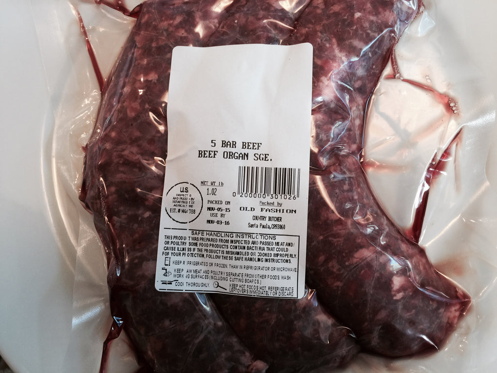 Photo of a package of 3 raw organ meat sausage links on a white background with a  USDA label on package